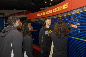 Students looking at one of the exhibits in the Hall of Fame