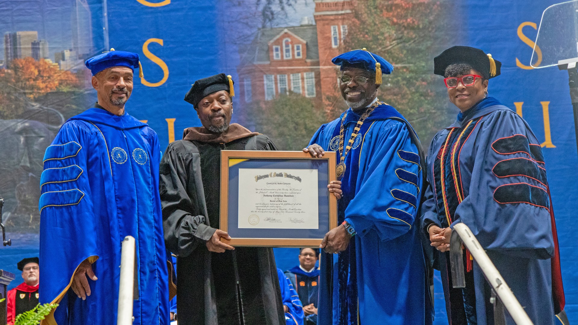 Trustee Steven L. Boyd, President Armbrister and Dr. Karen D. Morgan award Anthony Hamilton an honorary doctorate