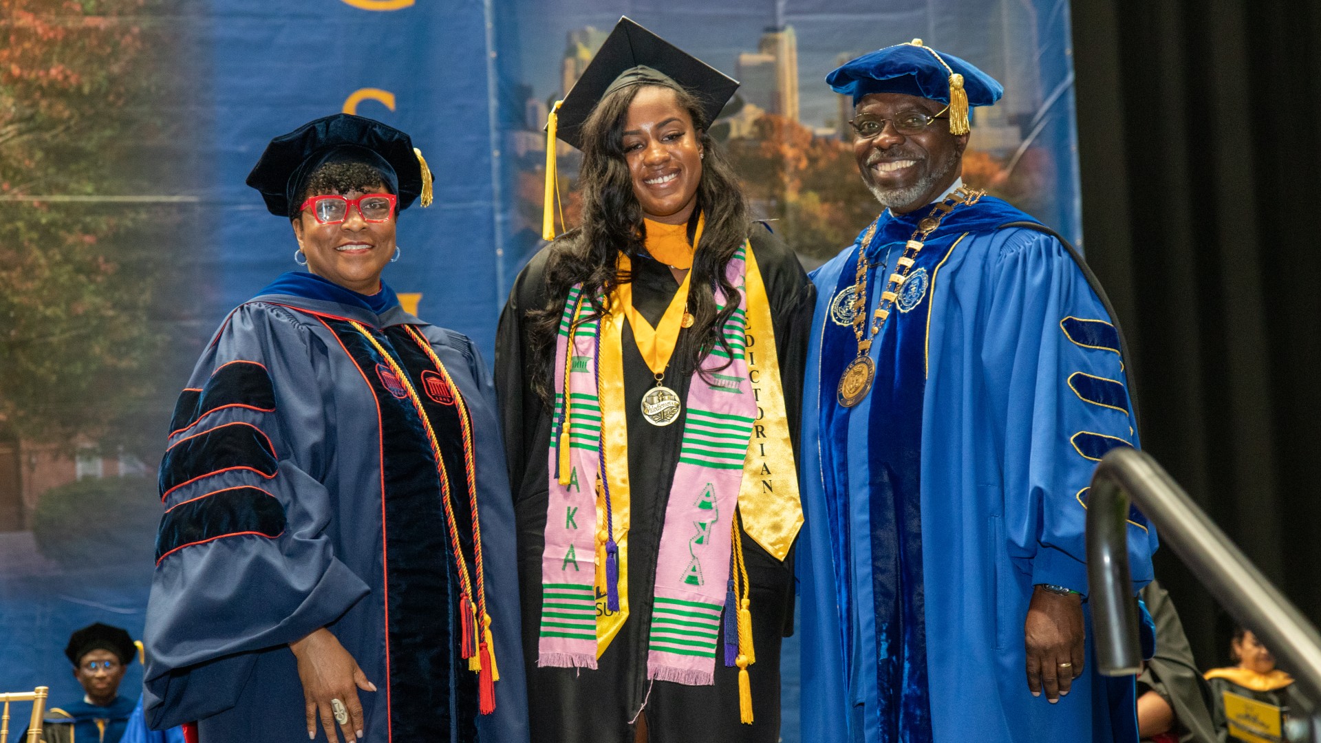 Dr. Karen D. Morgan and President Clarence D. Morgan with 2023 Valedictorian Taylor Proffett-Brooks