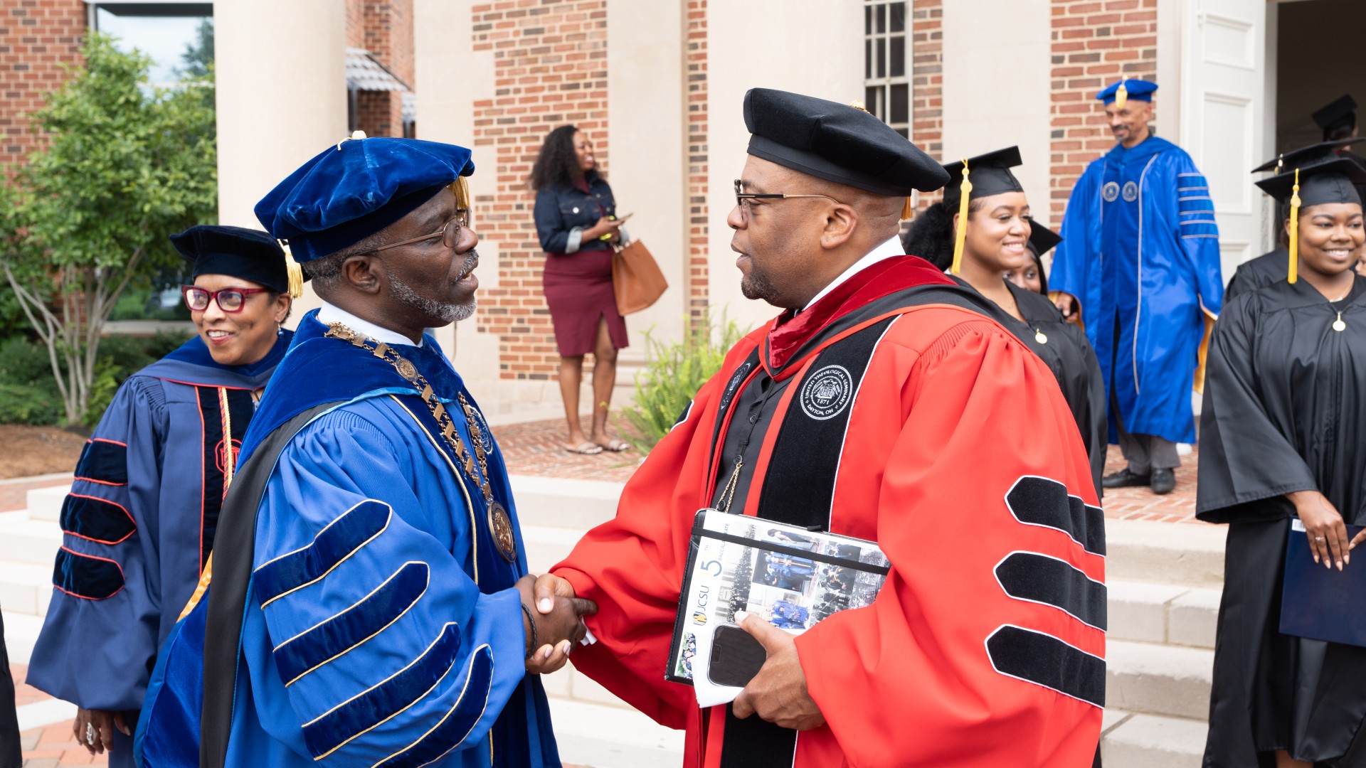 President Armbrister speaking to Rev. Dr. L. Bernard Jakes after Baccalaureate 2023