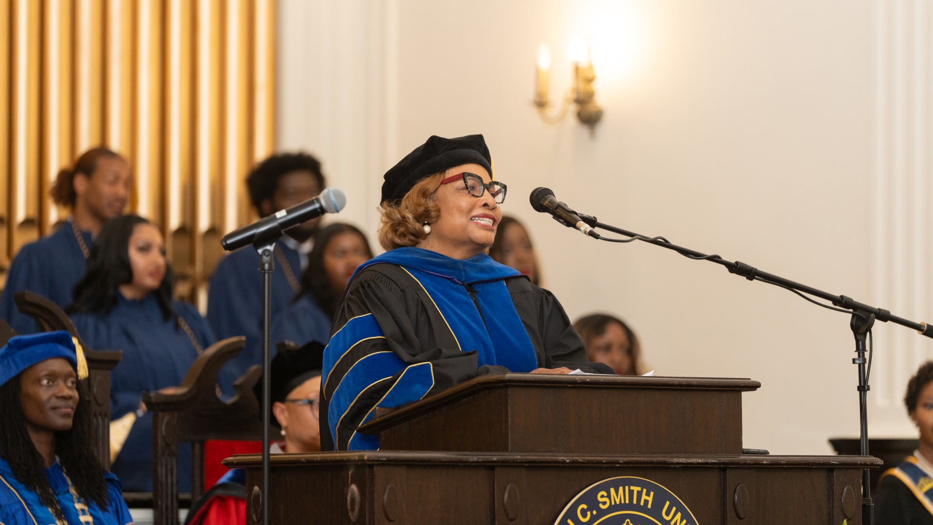 Cathy W. Jones, Dean of Students, presides over the freshman pinning ceremony