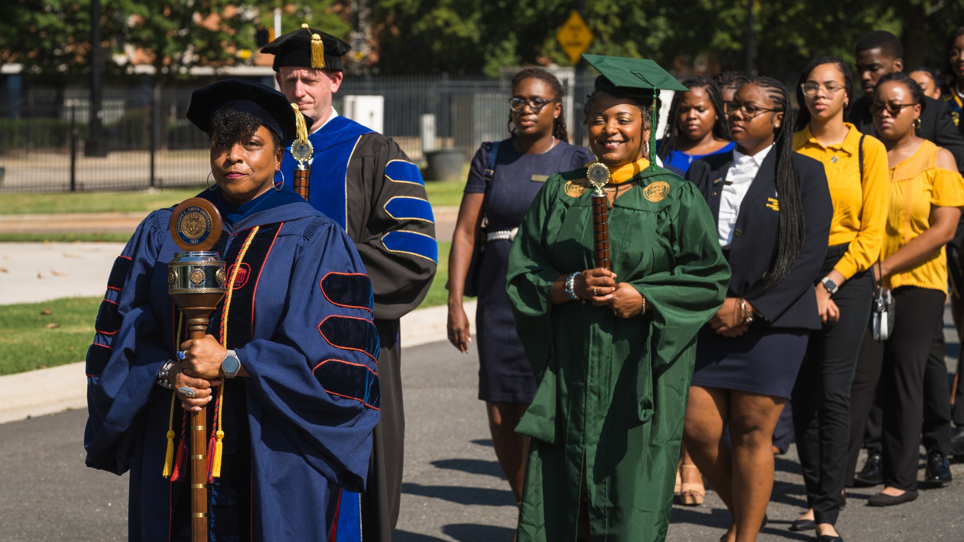 Students process across campus led by faculty during the 2023 Freshman Convocation Ceremony