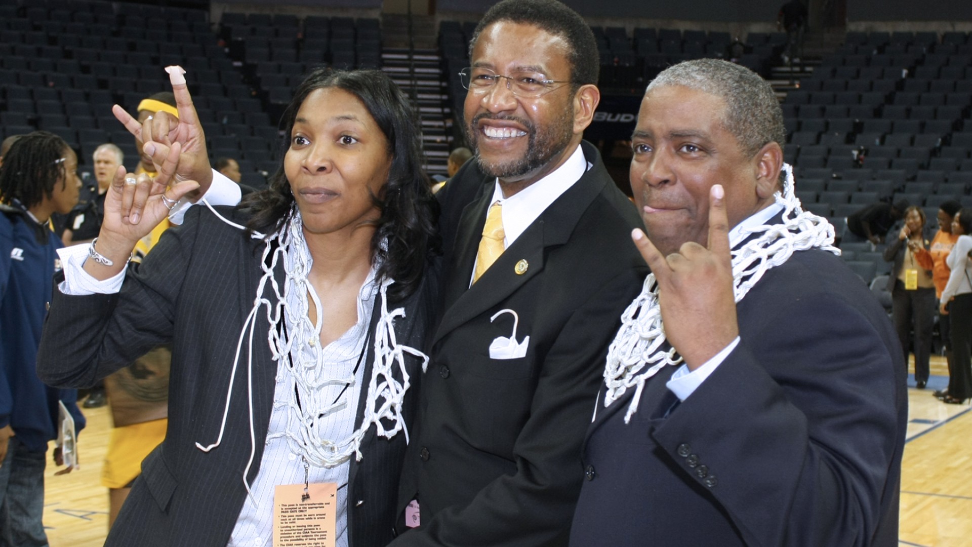 Steve Joyner with a basketball net around his head celebrating with President Ronald L. Carter after the 2008 CIAA Championship