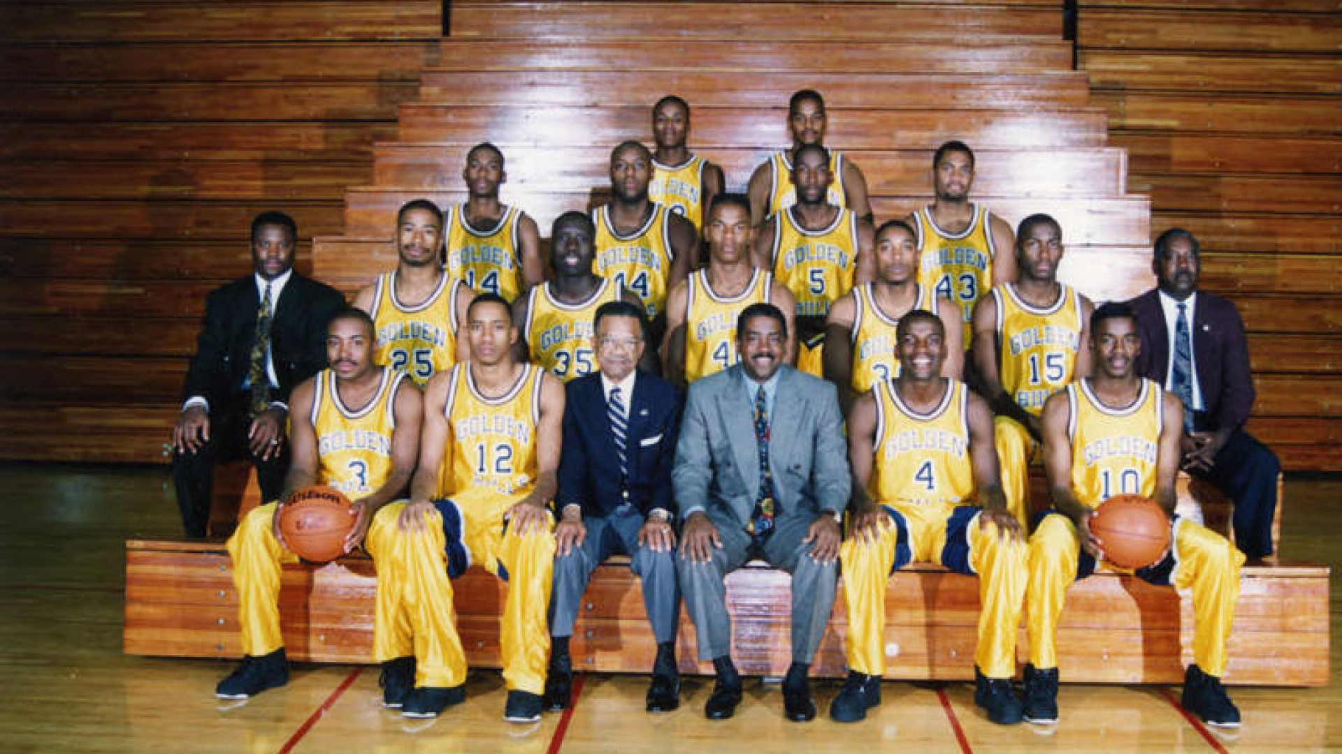 Photo of Steve Joyner with the Golden Bulls Basketball Team