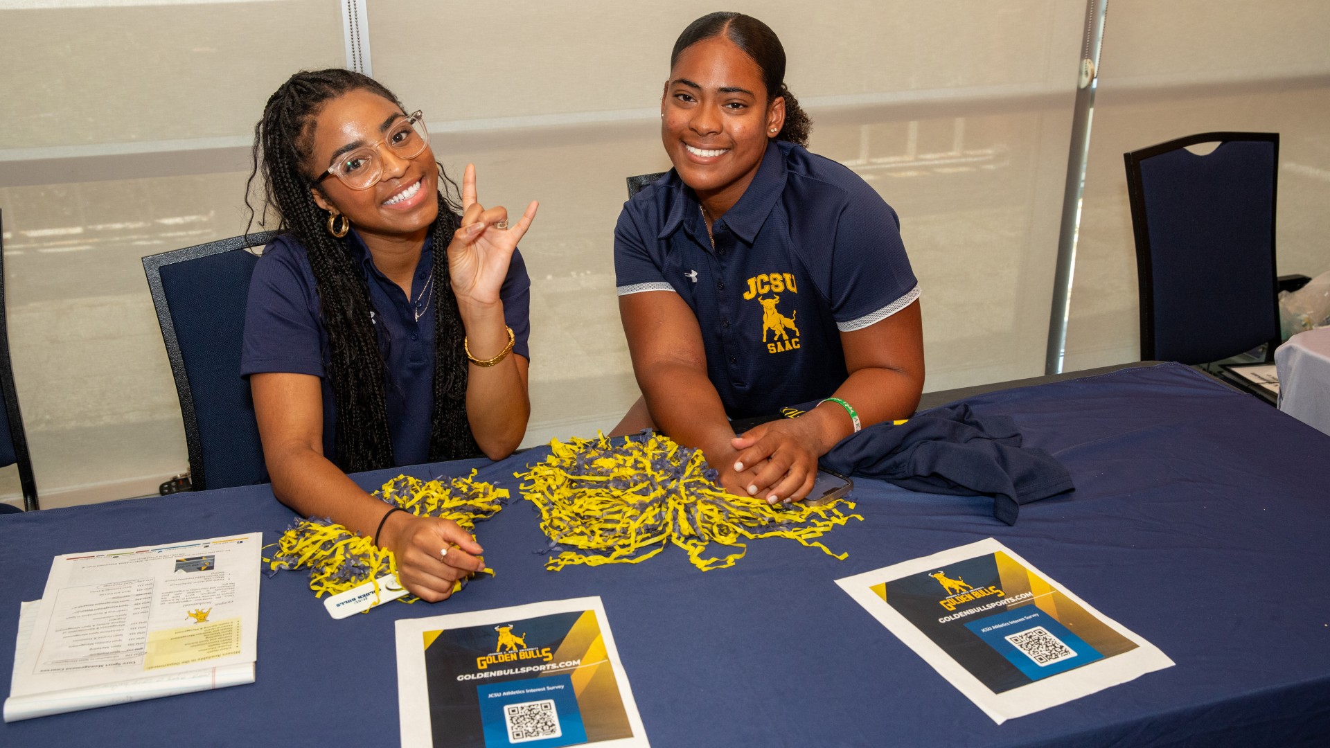 Students waiting to talk to families at the Organization Fair at Golden Bull Academy