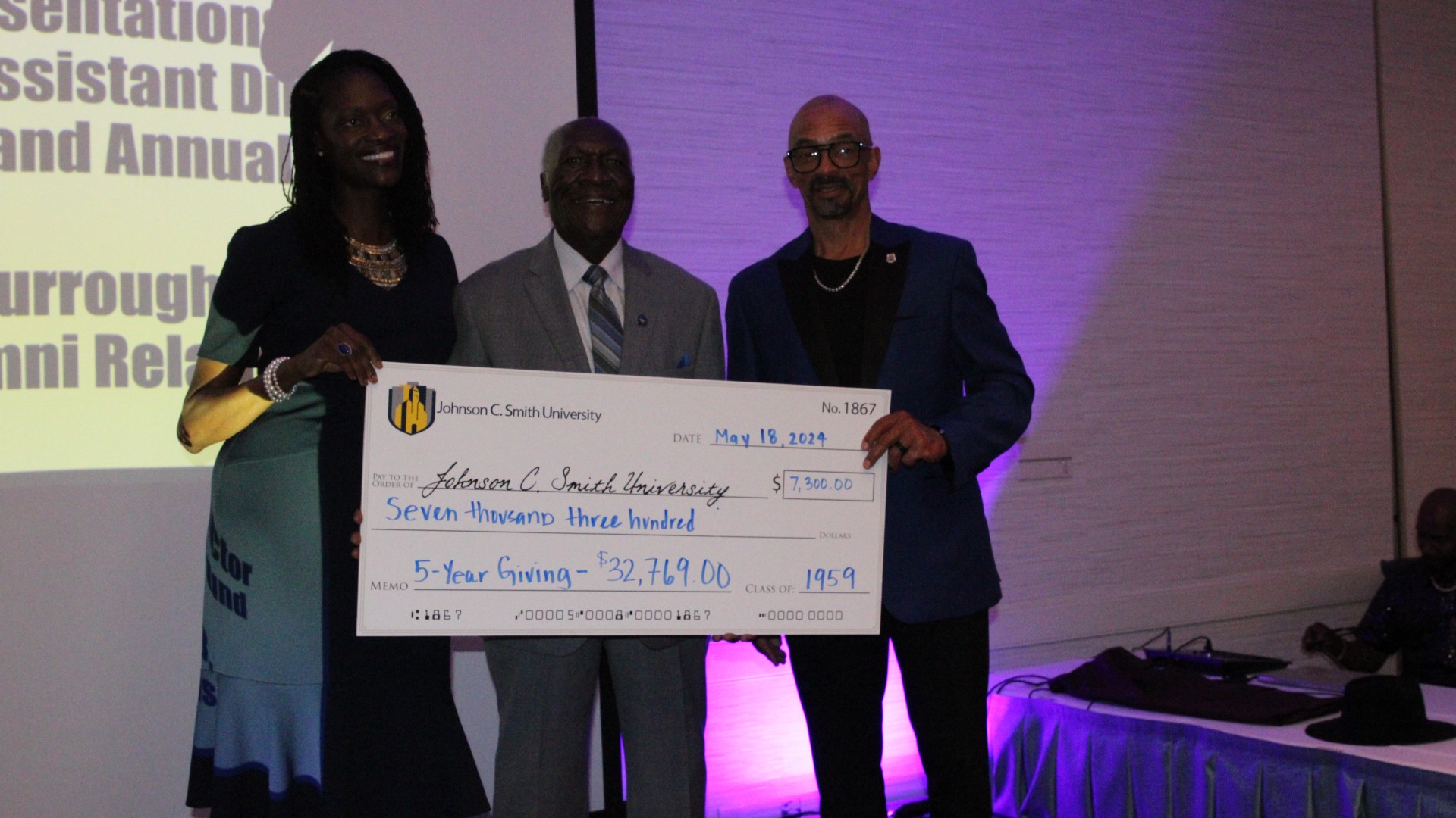 Check presentation at the alumni banquet