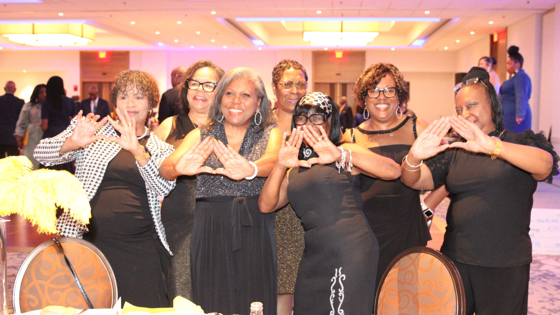 Group of Alumni posing at the banquet