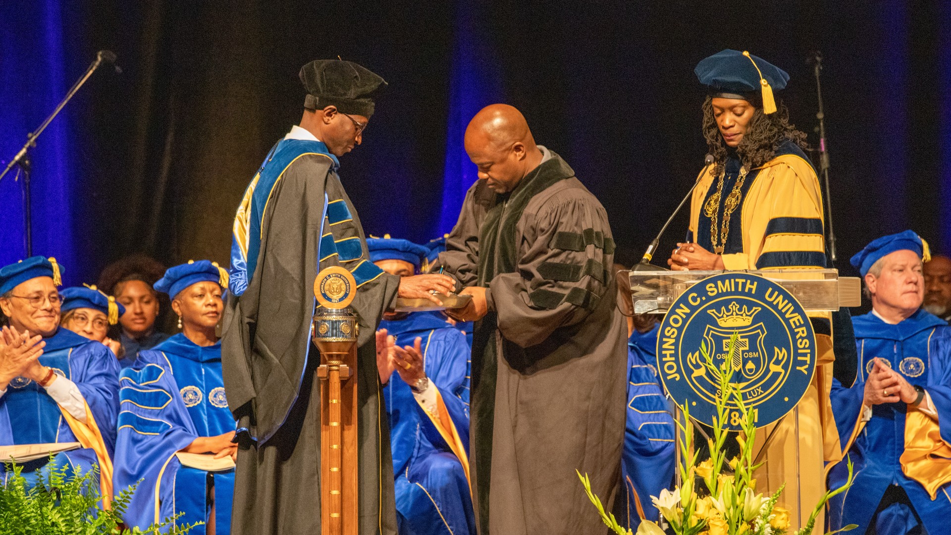 Chabot College president Dr. Jamal A. Cooks signs a memorandum of understanding between his college and JCSU during the Inauguration Ceremony
