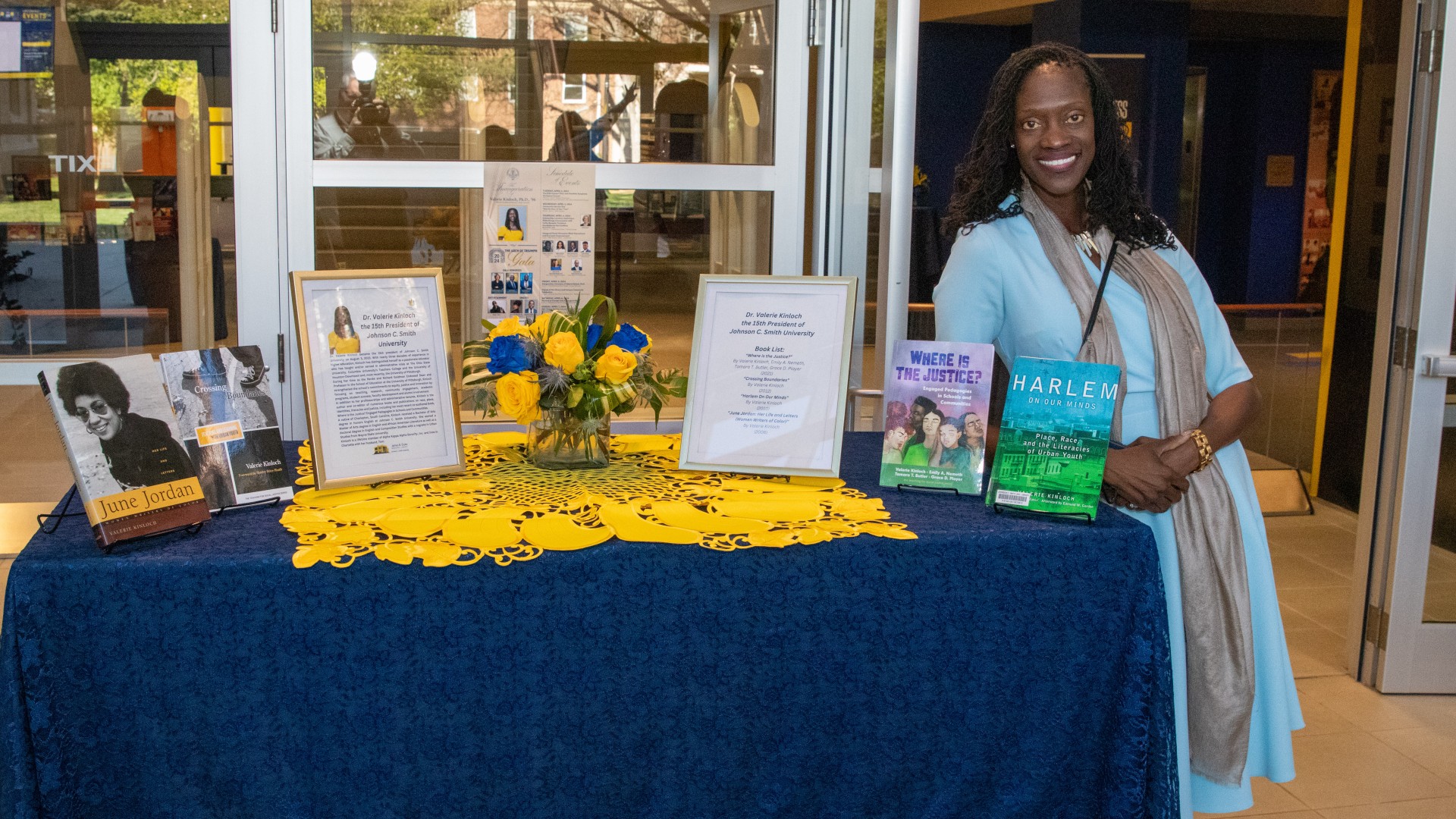 Dr. Kinloch poses with her books on display at the Friends of the Library event
