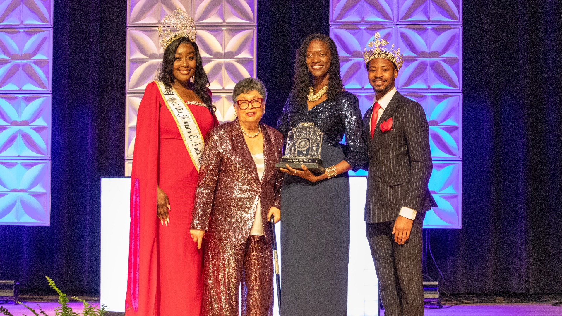 Dr. Yancy poses with were AOT Award with Dr. Kinloch and Mister JCSU Kameron Sanders and Miss JCSU Jessica McDonald