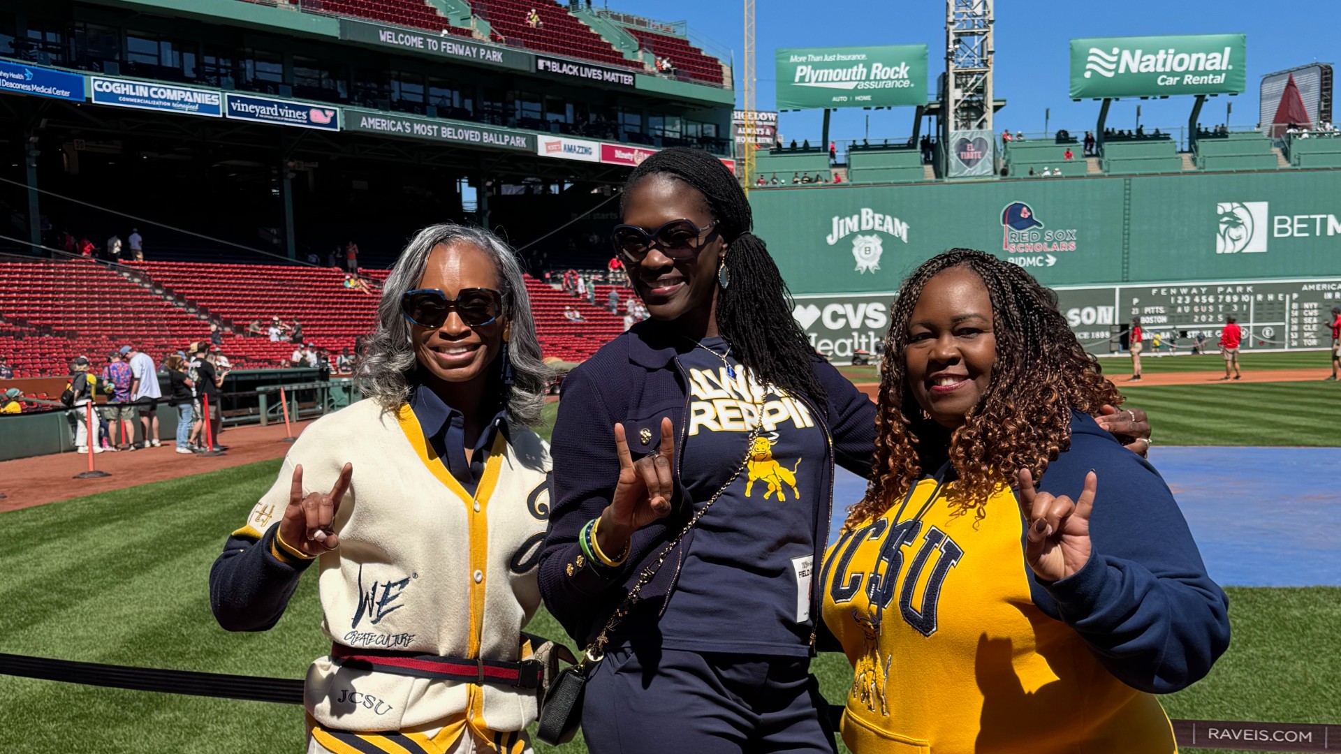 Dr. Kinloch, Dr. White and Tarji Caldwell at the baseball game