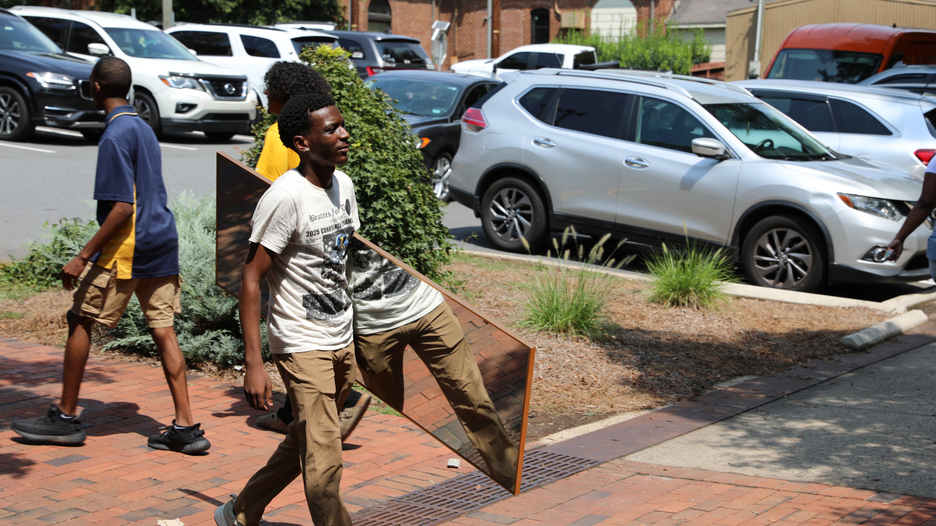 Student carries mirror in to Greenfield
